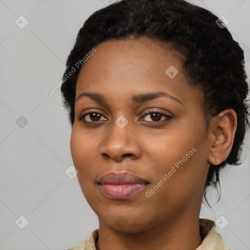 Joyful black young-adult female with medium  black hair and brown eyes