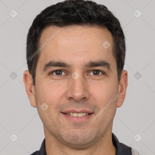 Joyful white adult male with short  brown hair and brown eyes