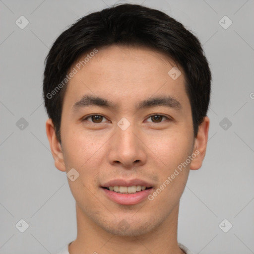 Joyful asian young-adult male with short  brown hair and brown eyes