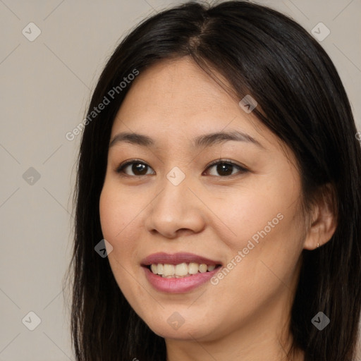 Joyful asian young-adult female with long  brown hair and brown eyes