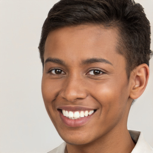 Joyful black young-adult male with short  brown hair and brown eyes