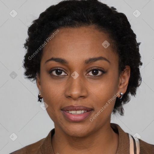 Joyful black young-adult female with short  black hair and brown eyes