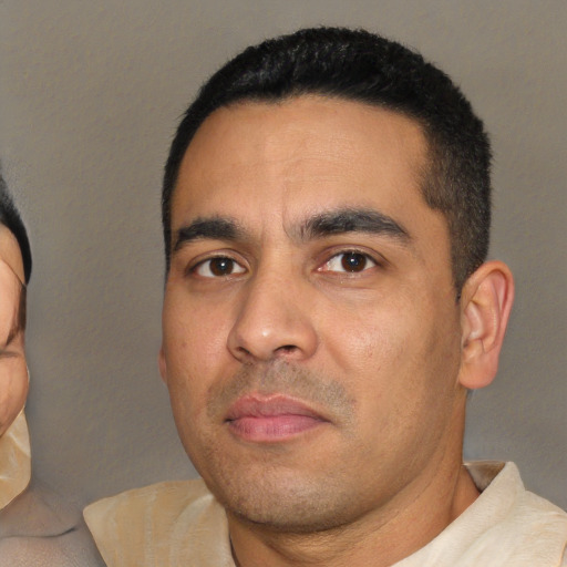 Neutral white young-adult male with short  black hair and brown eyes