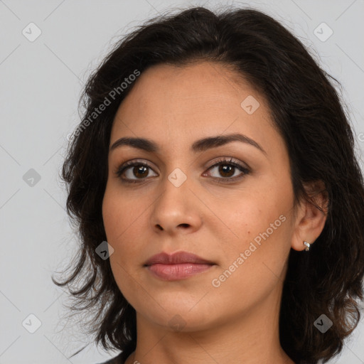 Joyful latino young-adult female with medium  brown hair and brown eyes