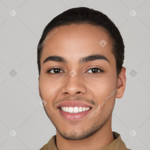 Joyful latino young-adult male with short  black hair and brown eyes