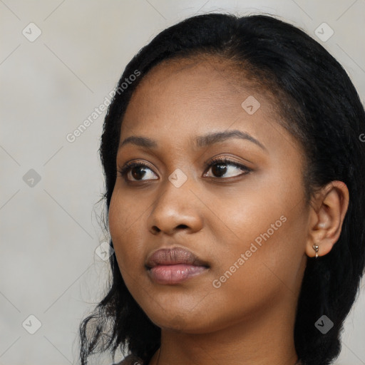 Neutral black young-adult female with long  black hair and brown eyes