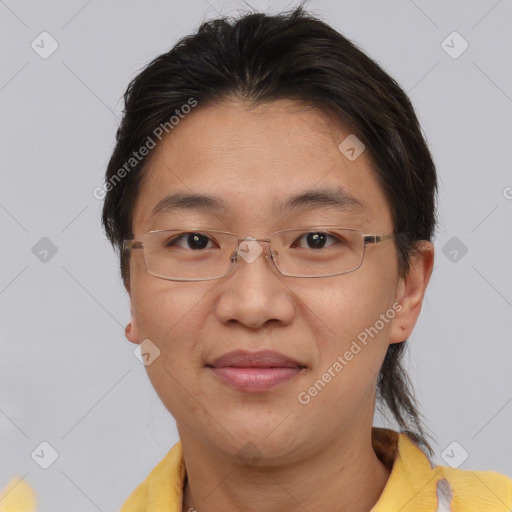 Joyful asian adult female with short  brown hair and brown eyes