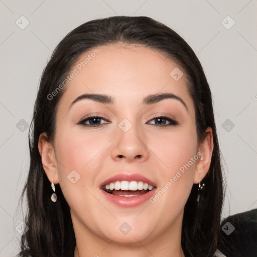 Joyful white young-adult female with long  black hair and brown eyes