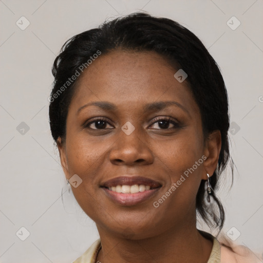 Joyful black adult female with medium  black hair and brown eyes