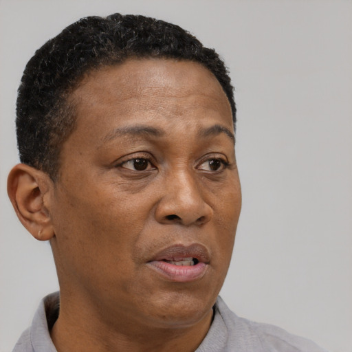 Neutral black adult female with short  brown hair and brown eyes