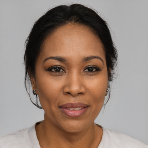Joyful latino young-adult female with medium  black hair and brown eyes