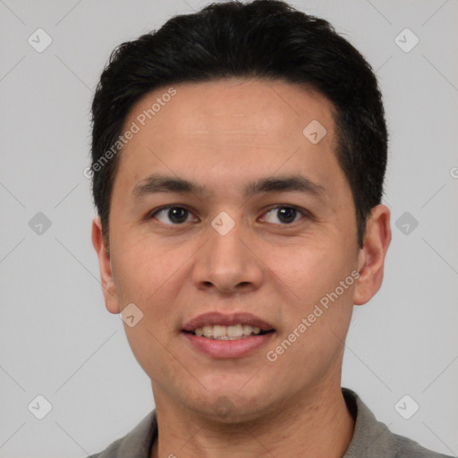 Joyful white young-adult male with short  black hair and brown eyes