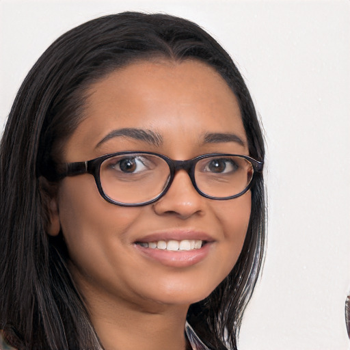 Joyful latino young-adult female with long  black hair and brown eyes