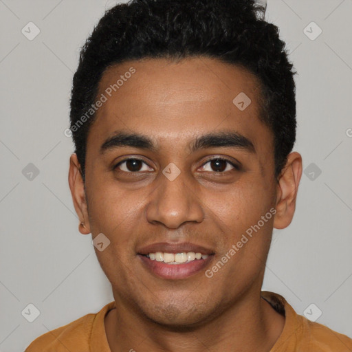Joyful black young-adult male with short  black hair and brown eyes
