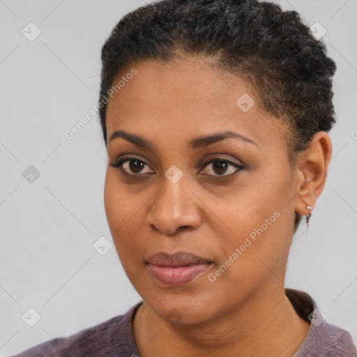 Joyful black young-adult female with short  brown hair and brown eyes