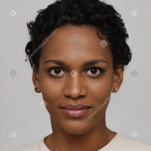 Joyful black young-adult female with short  black hair and brown eyes