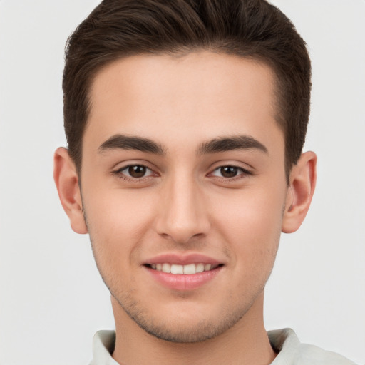 Joyful white young-adult male with short  brown hair and brown eyes