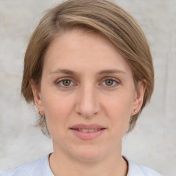 Joyful white adult female with medium  brown hair and grey eyes