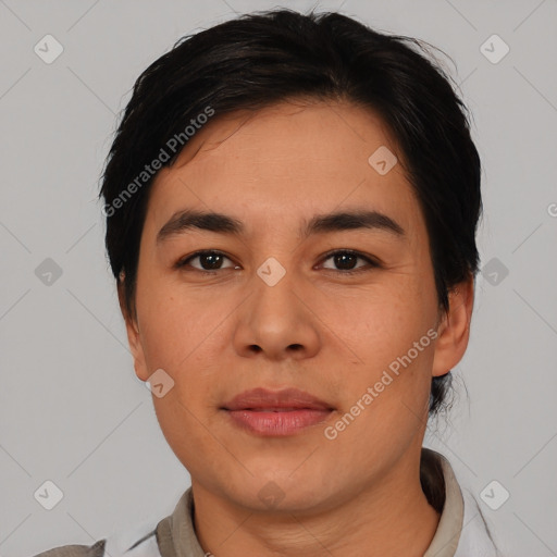 Joyful white young-adult male with short  black hair and brown eyes