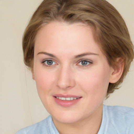 Joyful white young-adult female with medium  brown hair and blue eyes