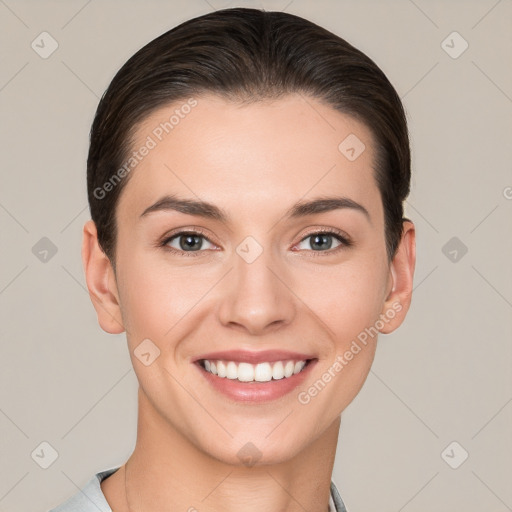 Joyful white young-adult female with short  brown hair and brown eyes