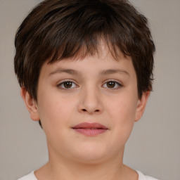 Joyful white child male with short  brown hair and brown eyes