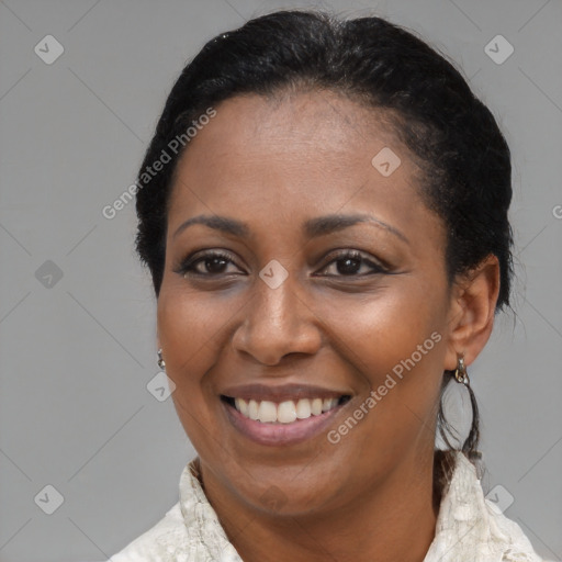 Joyful black young-adult female with medium  brown hair and brown eyes