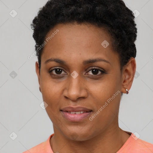 Joyful black young-adult female with short  brown hair and brown eyes