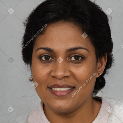 Joyful black adult female with short  brown hair and brown eyes