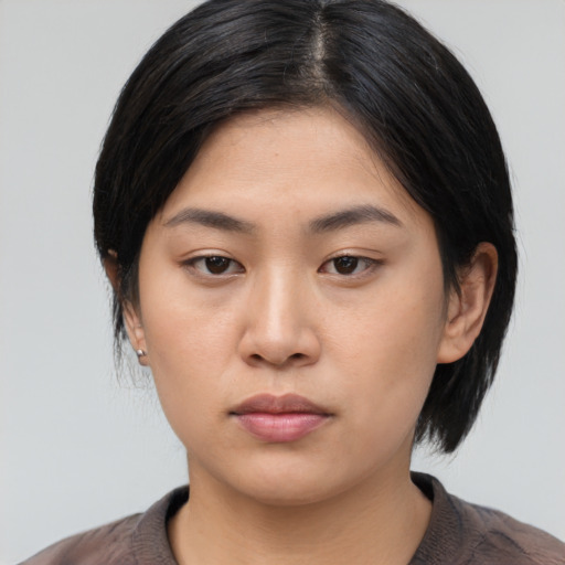 Neutral asian young-adult female with medium  black hair and brown eyes