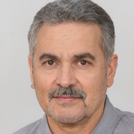 Neutral white middle-aged male with short  gray hair and brown eyes