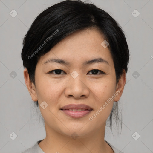 Joyful asian young-adult female with medium  black hair and brown eyes