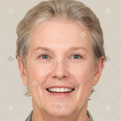 Joyful white adult female with short  brown hair and grey eyes