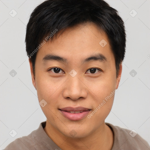 Joyful asian young-adult male with short  black hair and brown eyes