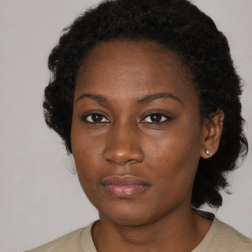 Neutral black young-adult female with medium  black hair and brown eyes