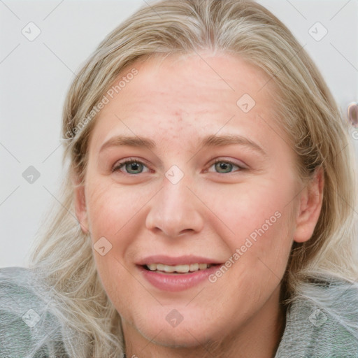 Joyful white young-adult female with medium  brown hair and blue eyes