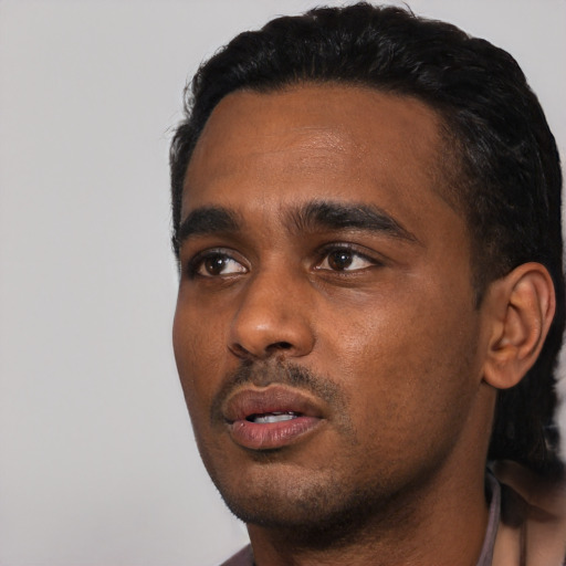 Neutral black young-adult male with short  black hair and brown eyes