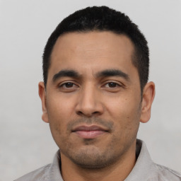 Neutral latino young-adult male with short  black hair and brown eyes