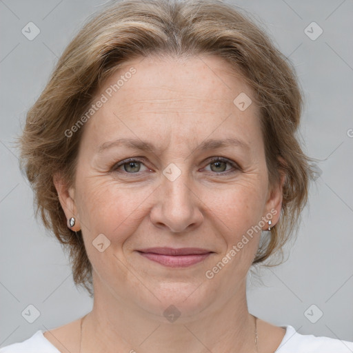 Joyful white adult female with medium  brown hair and grey eyes