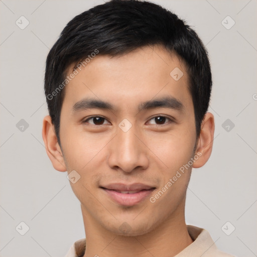 Joyful asian young-adult male with short  brown hair and brown eyes