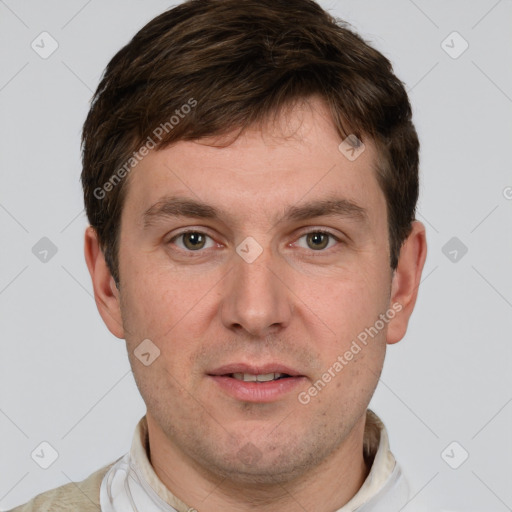 Joyful white adult male with short  brown hair and grey eyes