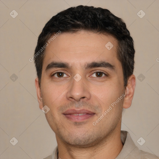 Joyful white young-adult male with short  black hair and brown eyes