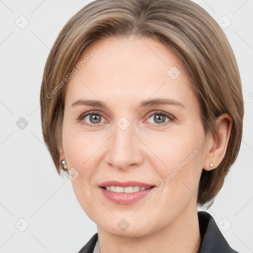 Joyful white adult female with medium  brown hair and grey eyes