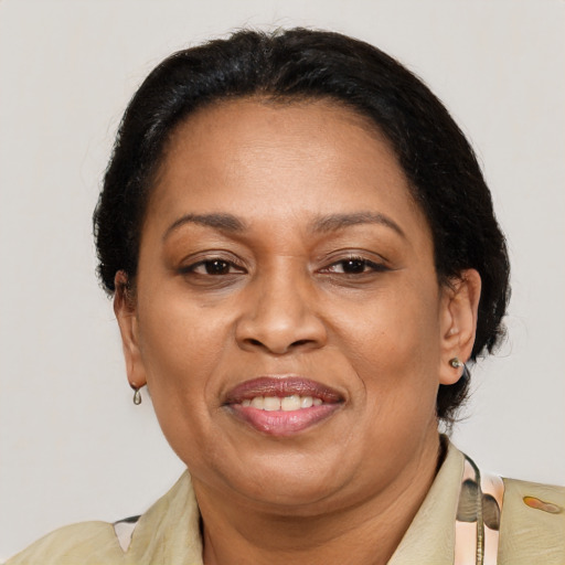 Joyful black adult female with medium  brown hair and brown eyes