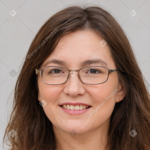 Joyful white adult female with long  brown hair and grey eyes