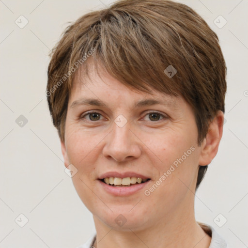 Joyful white adult female with short  brown hair and brown eyes