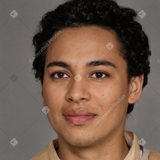 Joyful latino young-adult male with short  brown hair and brown eyes