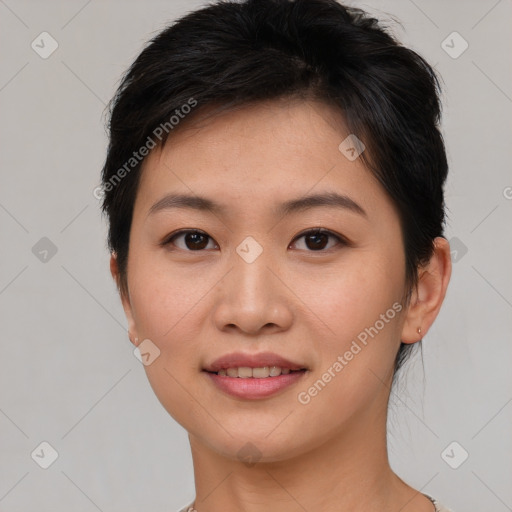 Joyful asian young-adult female with short  brown hair and brown eyes