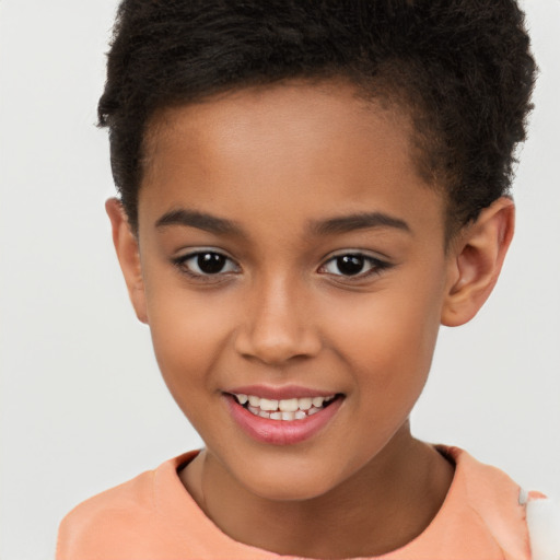 Joyful latino child female with short  brown hair and brown eyes