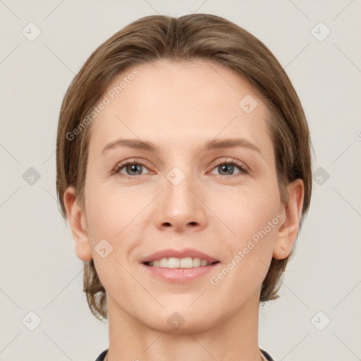 Joyful white young-adult female with short  brown hair and grey eyes